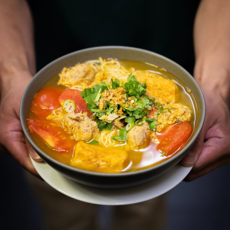 Tomato crab noodle soup with dungeness crab