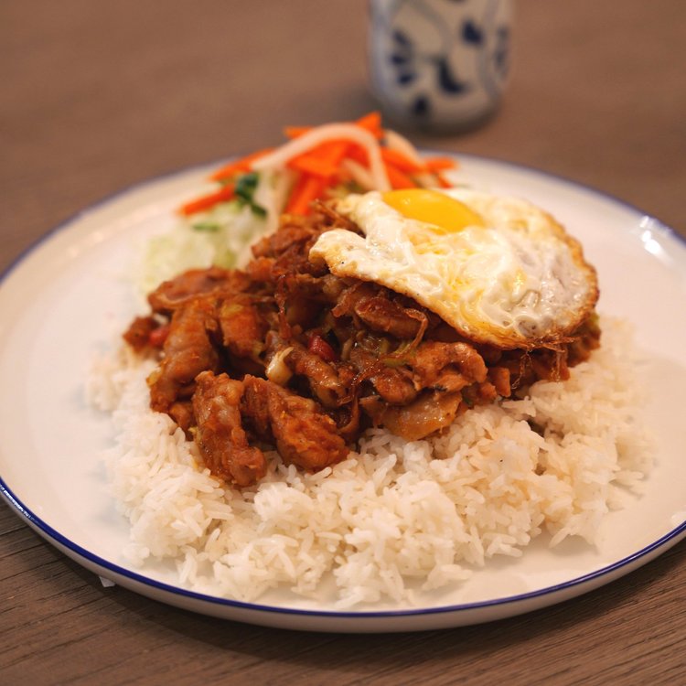 Lemongrass chili chicken with fried egg on rice