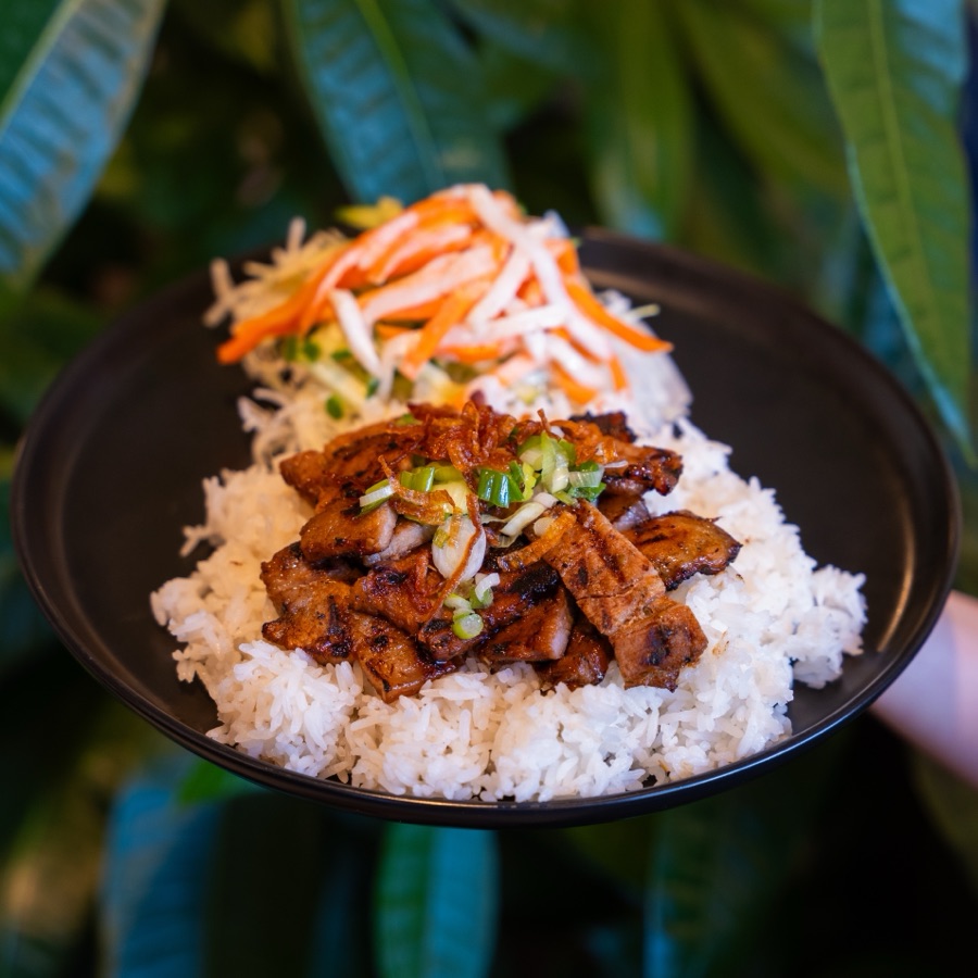 Grilled lemongrass pork belly on rice with pickled vegetables