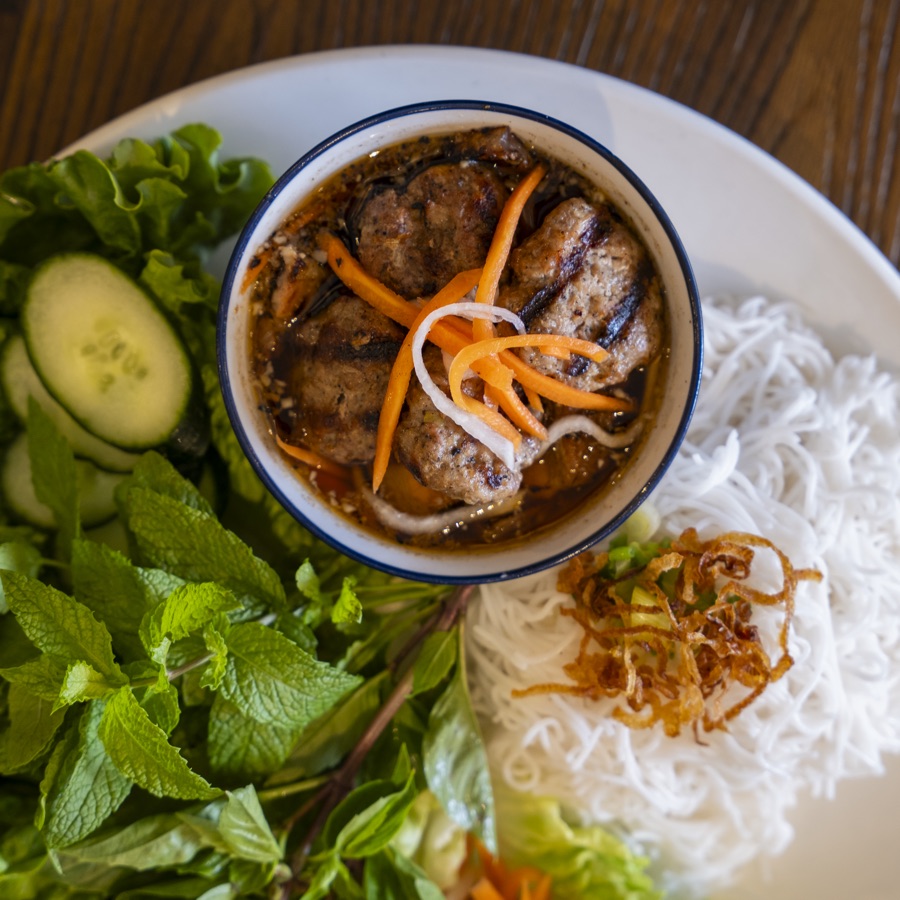 Hanoi grilled pork platter — bún chả with charred pork in garlic fish sauce, vermicelli, herbs and crispy shallots