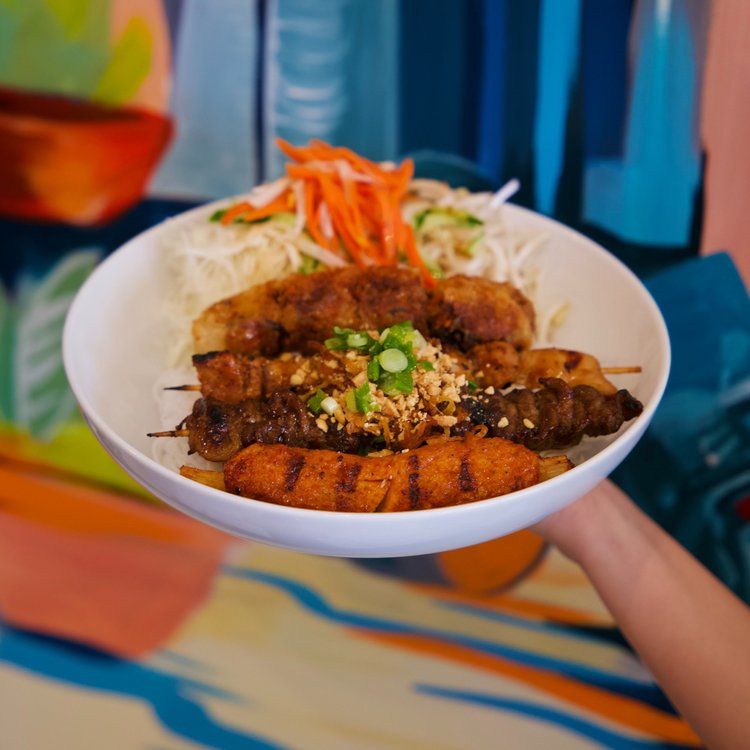 House vermicelli bowl with skewers and spring roll