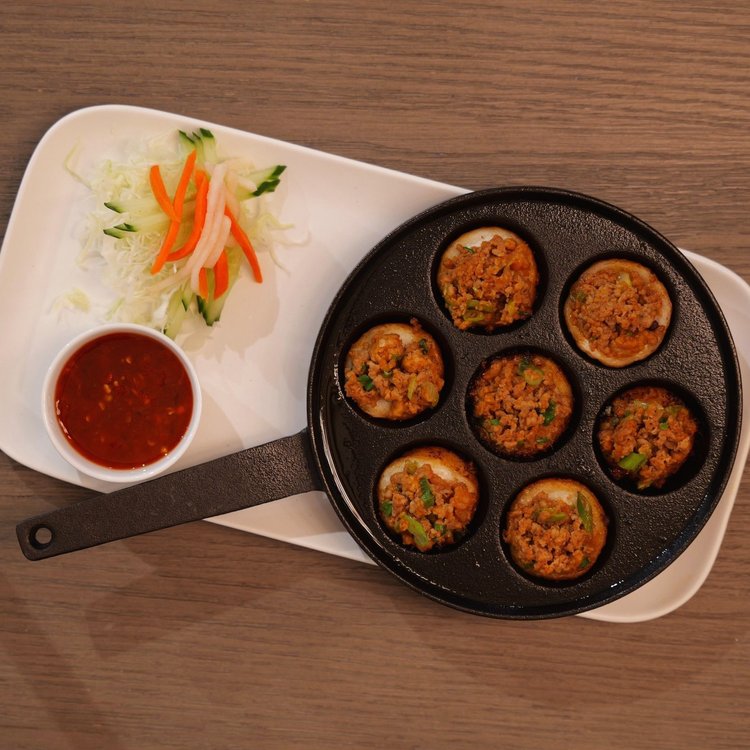 Coconut shrimp cakes in a cast iron pan
